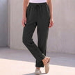 Black linen summer trousers for women with drawstring waist by FJØRNA, casual and comfortable for warm weather.