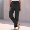 Black linen summer trousers for women with drawstring waist by FJØRNA, casual and comfortable for warm weather.