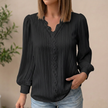 Black FJØRNA women’s pullover blouse with V-neck, lace trim, and textured pintuck details, perfect for casual or dressy wear.