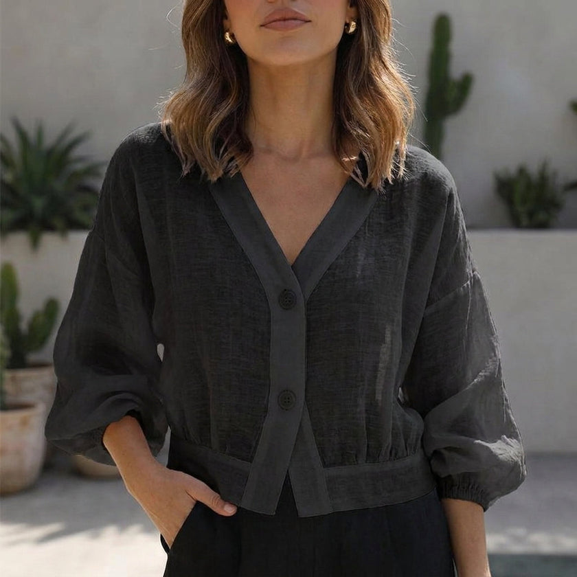 Black FJØRNA summer blouse for women with V-neck and high waist, stylish and comfortable women's top.