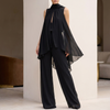 Black chiffon pleated two-piece women's co-ord set by FJØRNA, featuring a flowy top and matching wide-leg pants.