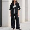 FJØRNA Coastal Chic black 2-piece set with contrast trim top and wide-leg pants, stylish and comfortable for casual wear