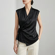 Black women's satin summer blouse with V-neck and sleeveless design, stylish top from FJØRNA.
