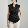 Black women's satin summer blouse with V-neck and sleeveless design, stylish top from FJØRNA.