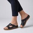 Black FJØRNA orthopedic open-toe slide sandals for women, featuring comfortable design and supportive sole.