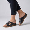 Black FJØRNA orthopedic open-toe slide sandals for women, featuring comfortable design and supportive sole.