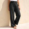 Black linen summer trousers for women with button front, stylish and lightweight from FJØRNA.
