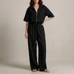 Black FJØRNA zip-neck top and wide-leg trouser set, 2-piece fashion ensemble with modern, effortless style.