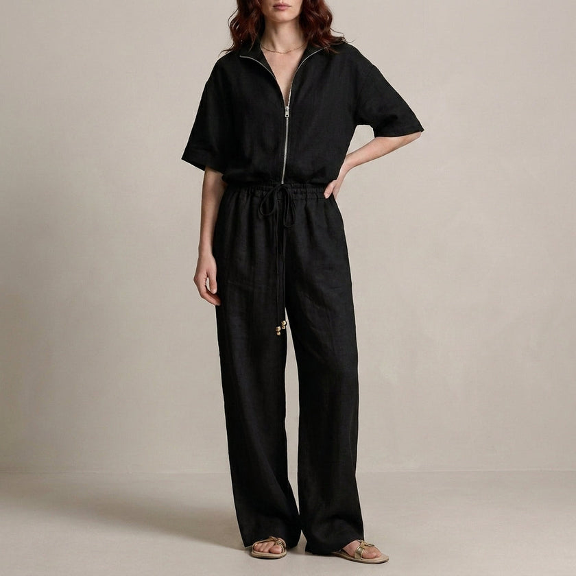 Black FJØRNA zip-neck top and wide-leg trouser set, 2-piece fashion ensemble with modern, effortless style.