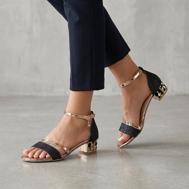 FJØRNA black orthopedic metallic block heel ankle strap sandals for women, stylish and supportive footwear with ankle buckle strap.
