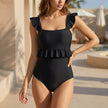 Black FJØRNA women's summer one-piece swimsuit with square neckline and ruffle details, perfect for stylish beachwear.