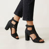Black FJØRNA women's orthopedic heeled sandals with adjustable strap and buckle, showcasing stylish and supportive footwear.