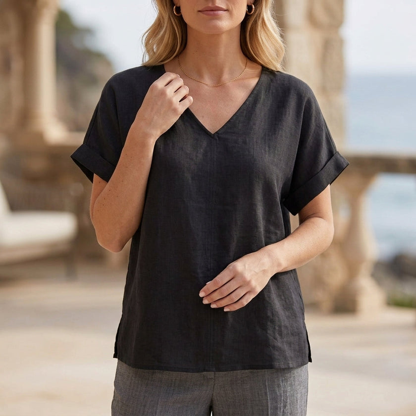 Black V-neck short sleeve denim blouse for women by FJØRNA, stylish summer top with a relaxed fit and classic denim look.