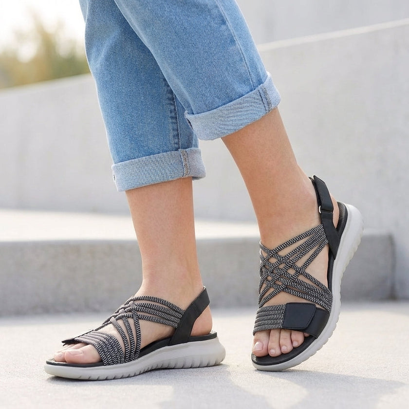Black FJØRNA orthopedic criss-cross strappy sandals for women with adjustable fit and supportive design.