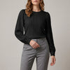 Black FJØRNA women's summer blouse with long sleeves and pleated denim fabric, stylish and lightweight for warm weather.