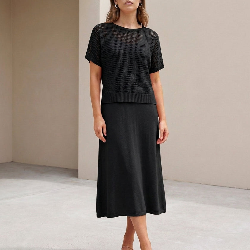 FJØRNA black flowing midi dress and cropped open-knit mesh top set, stylish 2-piece ensemble with elegant and breathable fabric.