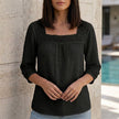 Black women's summer blouse with square neckline and lace details by FJØRNA, featuring a stylish and lightweight top for warm weather.