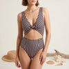 Black FJØRNA women's one-piece swimsuit with V-neck and cut-out stripes, perfect for summer swimwear.