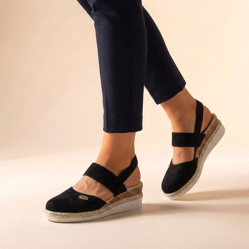 Black FJØRNA orthopedic platform espadrille sandals for women with woven jute soles and ankle straps.