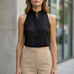 Black sleeveless denim summer blouse for women by FJØRNA, stylish casual top with relaxed fit and sleeveless design.