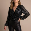 Black V-neck long sleeve sequin summer blouse for women by FJØRNA, featuring a stylish and elegant design.