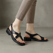 Black FJØRNA square toe block heel criss-cross women's sandals, featuring stylish open-toe design and comfortable chunky heel.