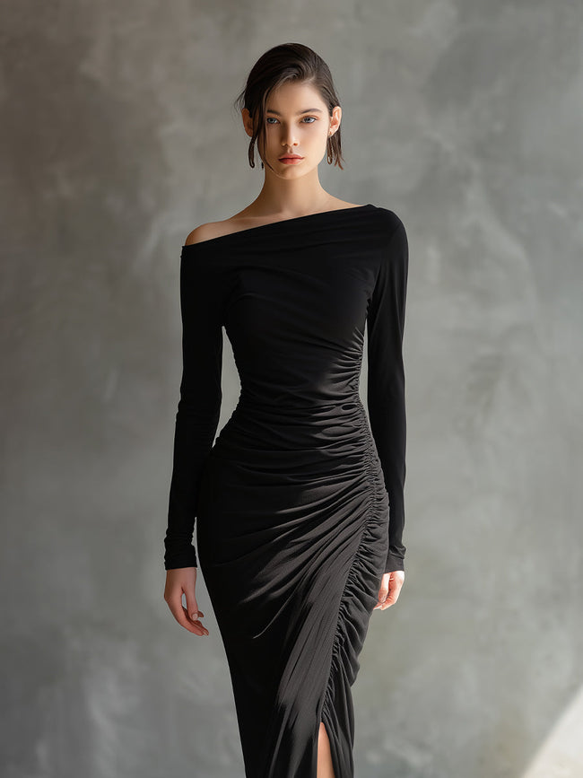 Black jersey ruched maxi dress by FJØRNA, elegant evening dress with fitted silhouette and flowing length.