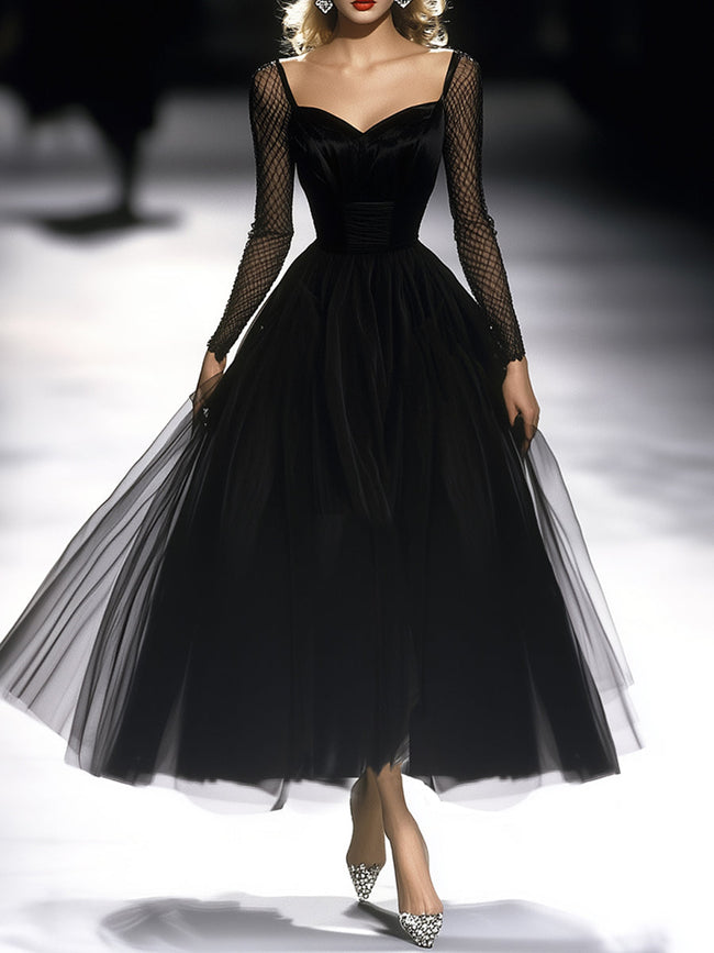 FJØRNA black maxi dress for women, flowing long dress with sleeveless design and elegant neckline, styled for a sophisticated look.