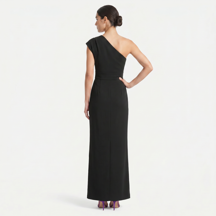 FJØRNA women's black one-shoulder maxi evening dress with asymmetric neckline, shown from back profile. Elegant and stylish dress.