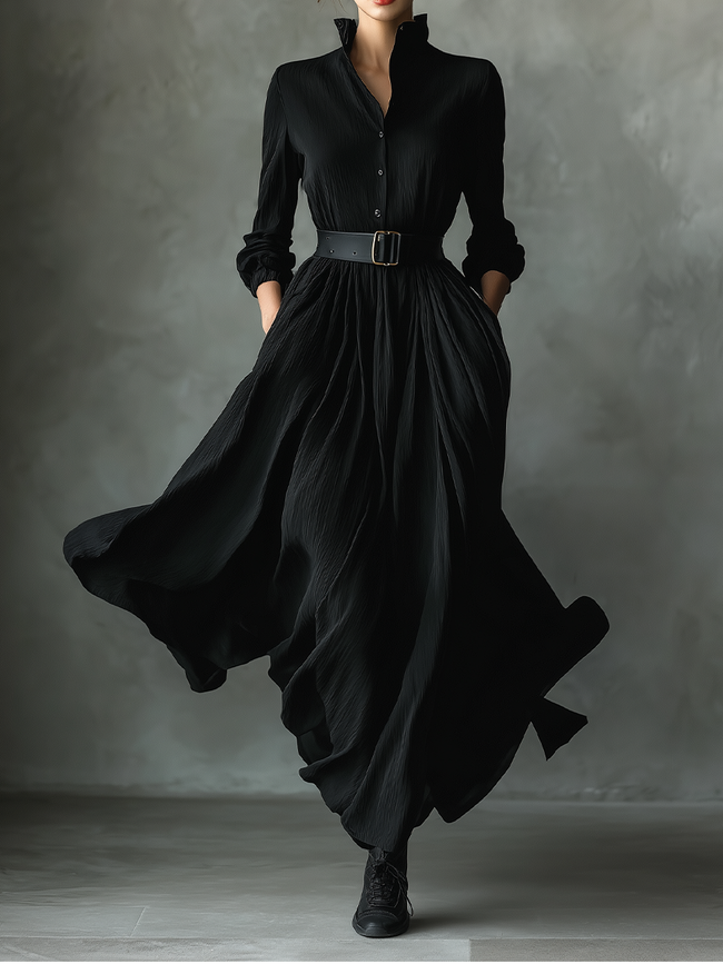 Black pleated maxi dress for women by FJØRNA, flowing fabric, sleeveless design, and elegant pleats visible in the image.