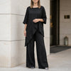 FJØRNA relaxed black two-piece set with flowing wide-leg pants, stylish and comfortable for casual or elegant wear.