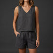 Black women's summer two-piece set by FJØRNA with pleated design and V-neck, featuring a stylish co-ord outfit in the image.