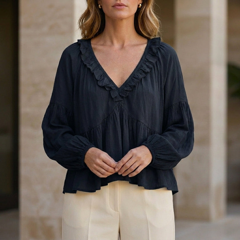 Black V-neck long sleeve denim blouse for women with ruffle details, by FJØRNA, featuring a stylish summer blouse design.