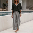 Black striped high waist summer two-piece set for women by FJØRNA, featuring a coordinated top and skirt.