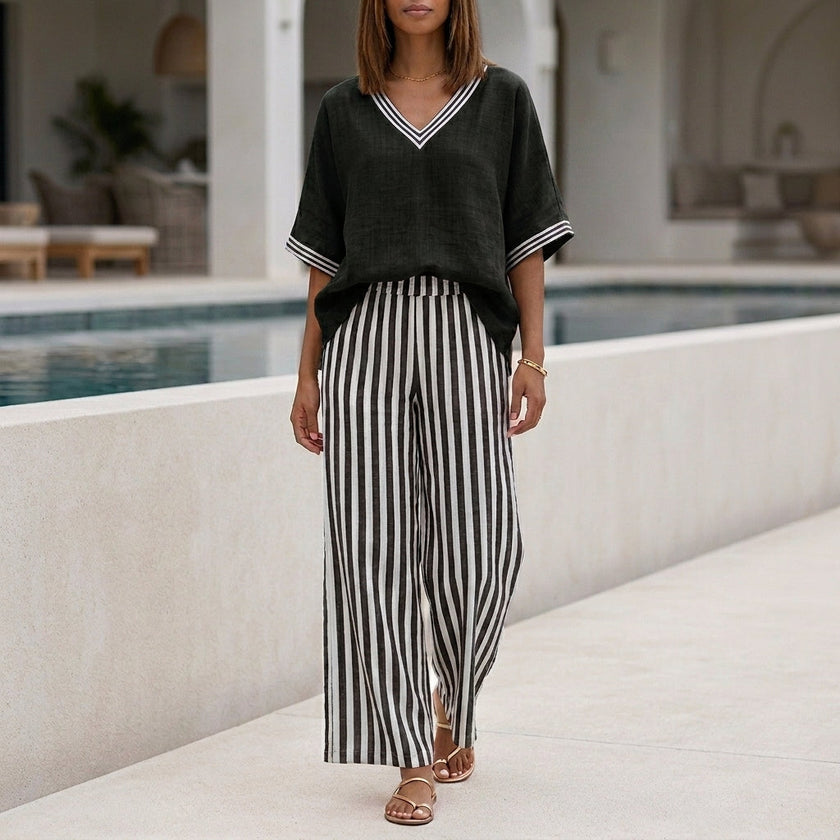 Black striped high waist summer two-piece set for women by FJØRNA, featuring a coordinated top and skirt.