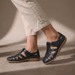 Black FJØRNA orthopedic cutout fisherman sandals for women, showcasing adjustable straps and supportive design.