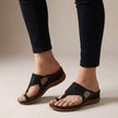 Black FJØRNA orthopedic floral embroidered wedge sandals for women with supportive design and decorative flower embroidery.