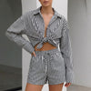 Black FJØRNA women's summer two-piece striped co-ord set with drawstring waist and short sleeves.