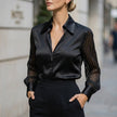 Black FJØRNA summer women's blouse with striped pattern and high waist, shown on a model.