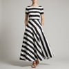 Black FJØRNA A-line striped maxi dress with pockets, featuring a flowy design and casual elegance for women.