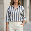 Black striped summer blouse for women by FJØRNA featuring long sleeves and a stylish, lightweight design.