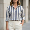 Black striped summer blouse for women by FJØRNA featuring long sleeves and a stylish, lightweight design.