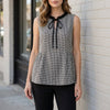 Black Gingham sleeveless summer blouse for women by FJØRNA, featuring a stylish and breathable top in a classic pattern.