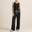 FJØRNA black contrast trim two-piece set with relaxed wide-leg pants and matching top on model.
