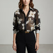 Black floral long sleeve summer blouse for women by FJØRNA, featuring a lightweight, stylish design with a relaxed fit.