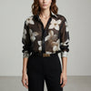 Black floral long sleeve summer blouse for women by FJØRNA, featuring a lightweight, stylish design with a relaxed fit.