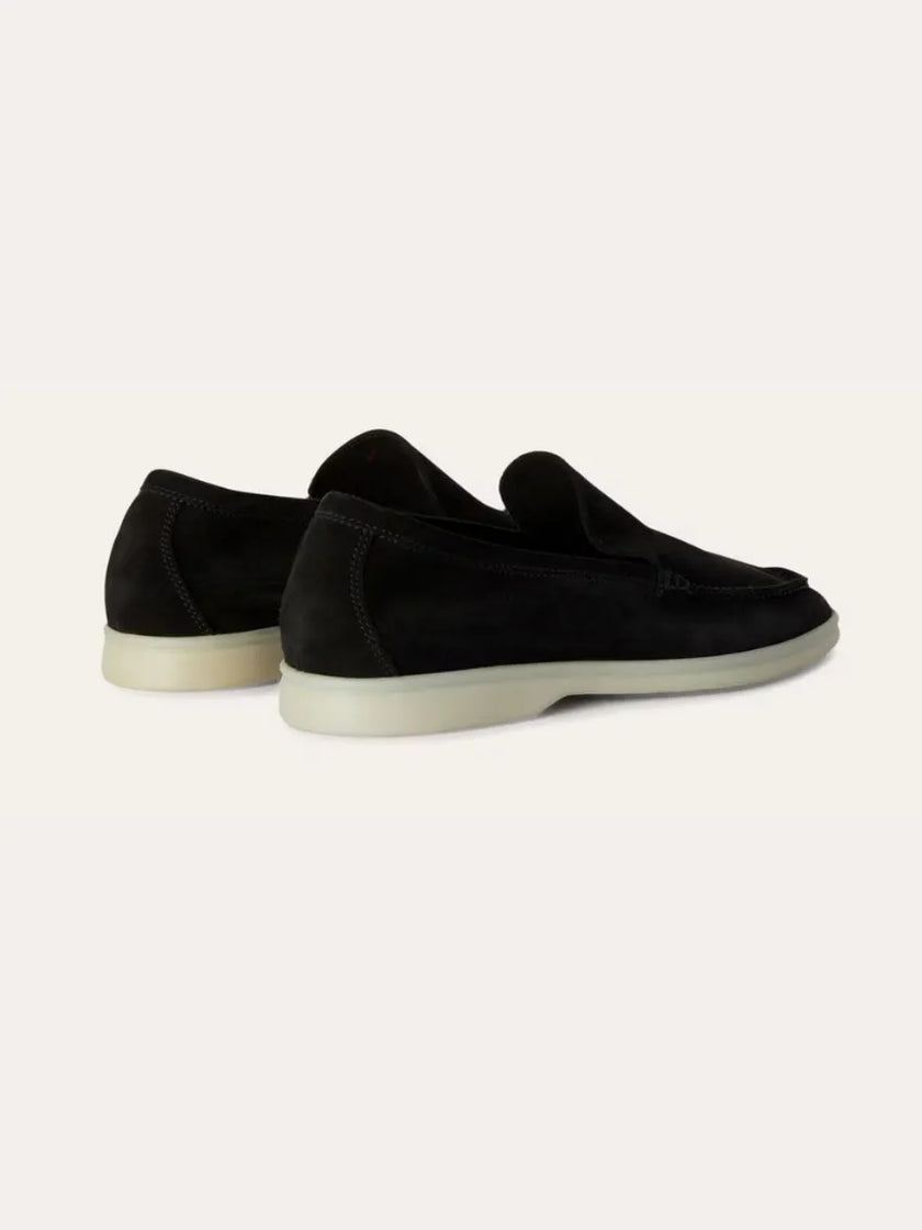 Men's black suede calfskin moccasins by FJØRNA, showcasing slip-on design and detailed stitching on smooth leather shoes.