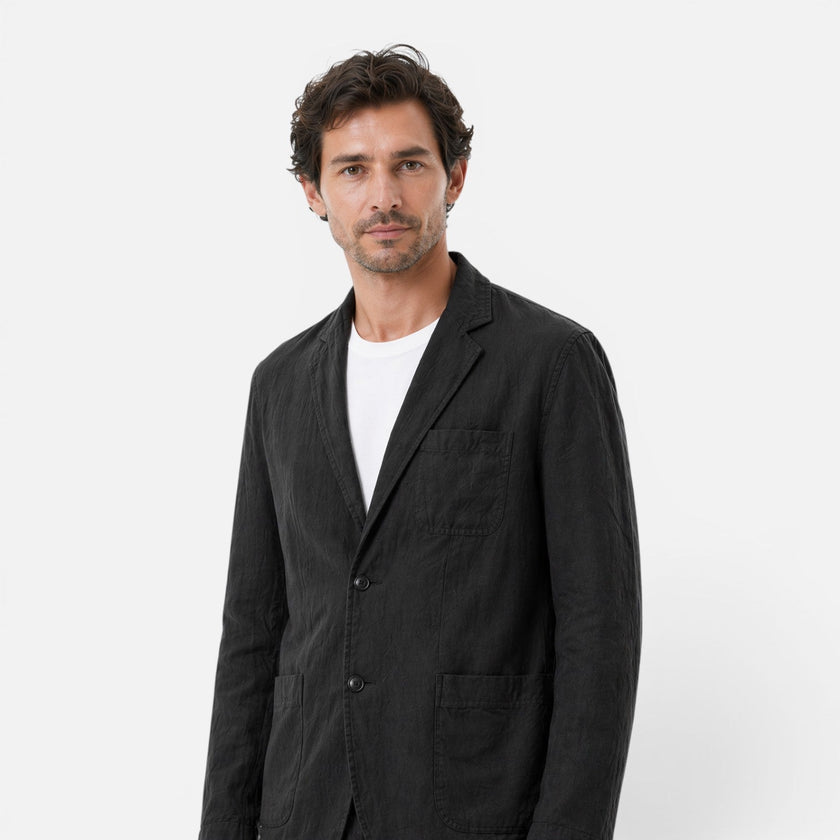 Men's linen suit set by FJØRNA featuring a lightweight, breathable blazer and trousers for a classic summer look.