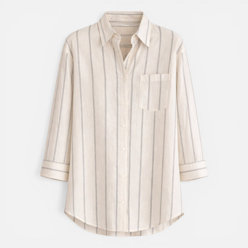 Women's striped button-down shirt by FJØRNA, relaxed fit, lightweight blouse with blue and white stripes.