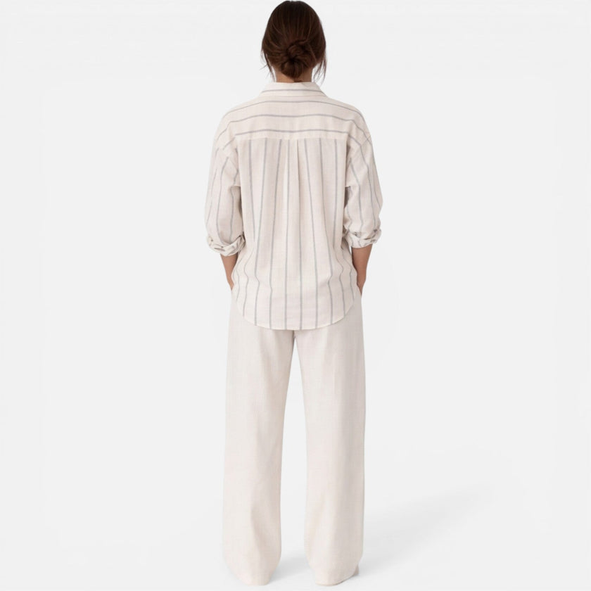 Women's striped button-down relaxed fit lightweight shirt by FJØRNA, featuring a casual, stylish blouse with vertical stripe pattern.